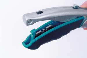 Cúter de cuchillas trapezoidales de cambio rápido con cuchilla retráctil