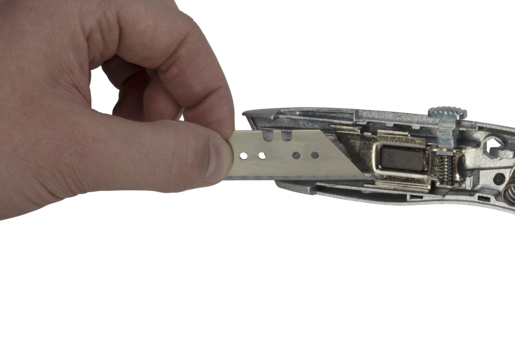 Cúter de cuchillas trapezoidales con cuchilla retráctil